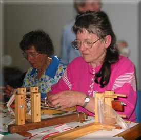 Jackie concentrates on the inkle loom.
